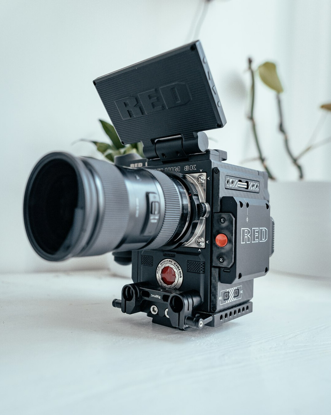 Broadcast camera framing a lit interview set