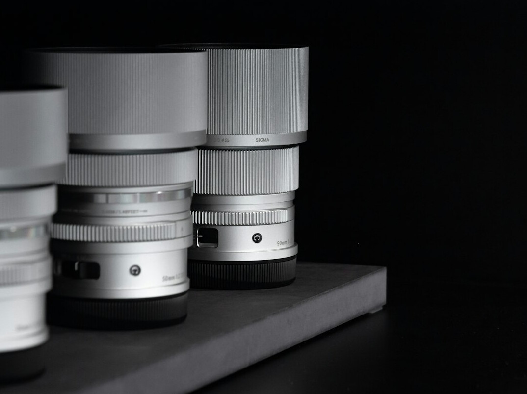 Close-up of broadcast camera lens with studio lighting