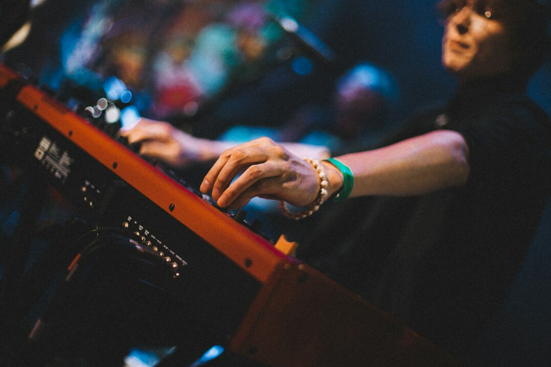 Sound engineer woman working at audio mixing console
